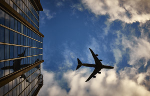 Airplane flying over a building